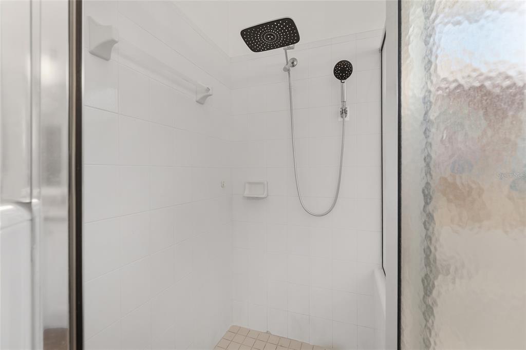 7982 Southwest 83rd Terrace Gainesville, FL 32608 - Photo 31 of 53 a bathroom with a glass shower door