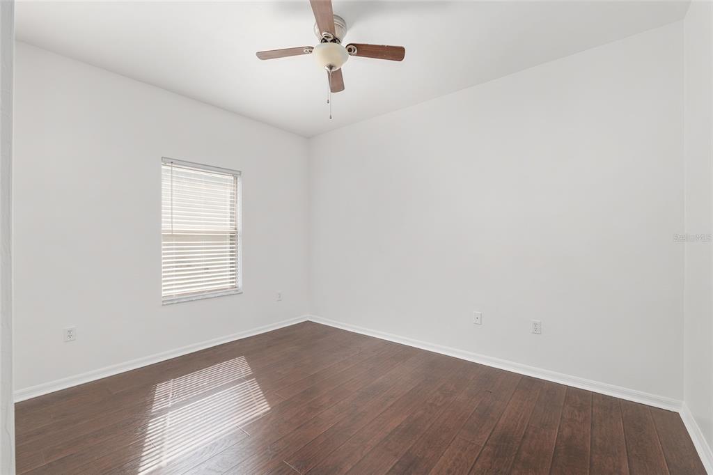 7982 Southwest 83rd Terrace Gainesville, FL 32608 - Photo 36 of 53 wooden floor in an empty room with a window