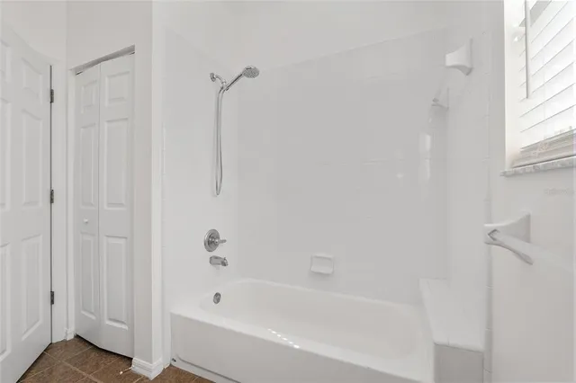 a view of an entryway with wooden floor