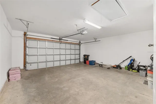 a living room with furniture and large windows