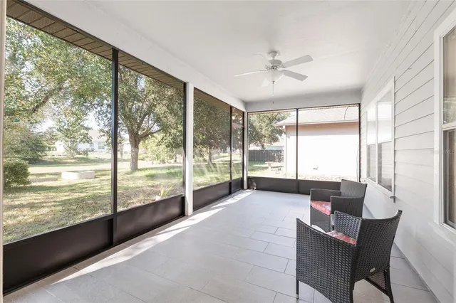 a view of a backyard with swimming pool