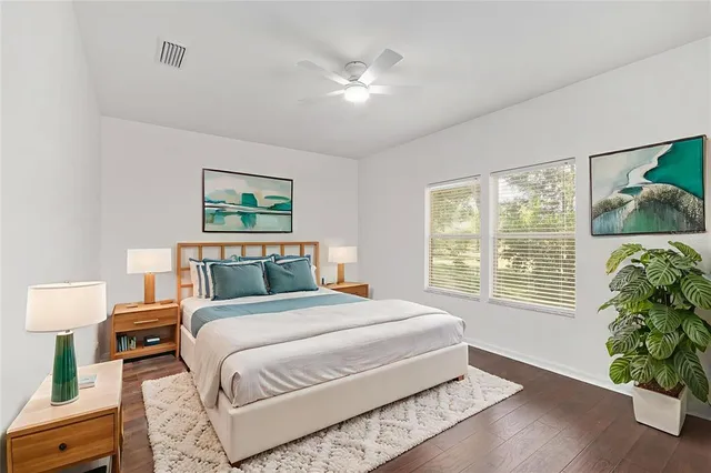 a bedroom with a large bed and a window