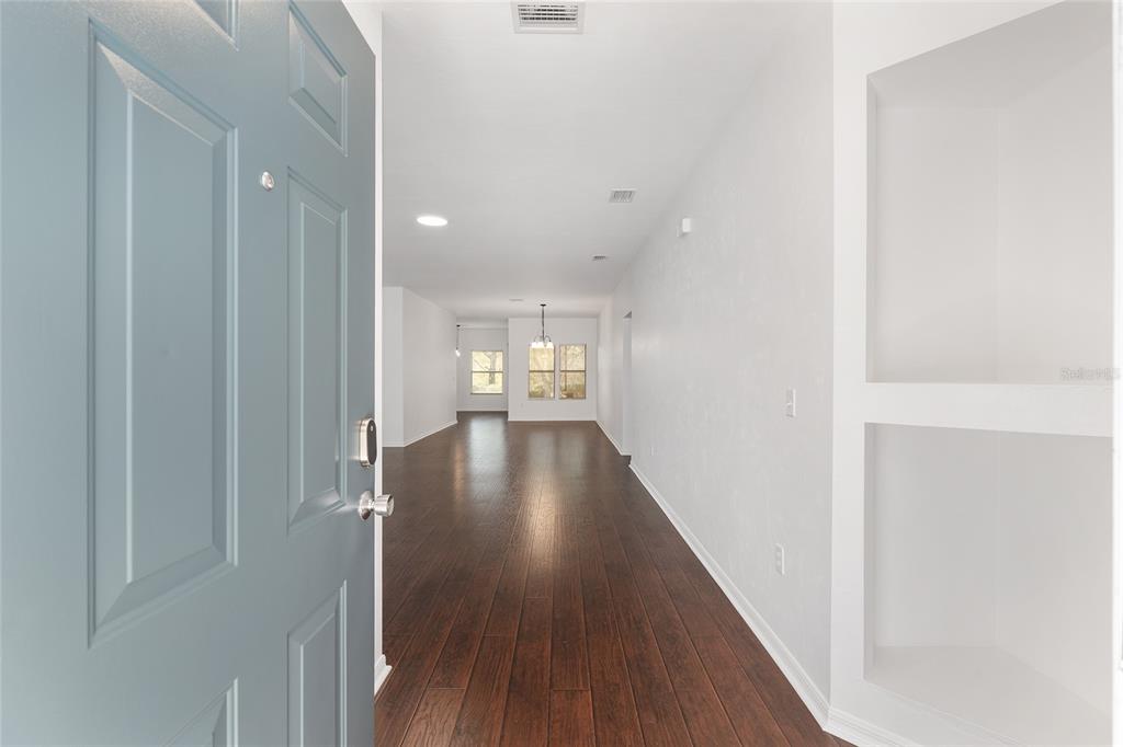 7982 Southwest 83rd Terrace Gainesville, FL 32608 - Photo 6 of 53 a view of hallway with wooden floor