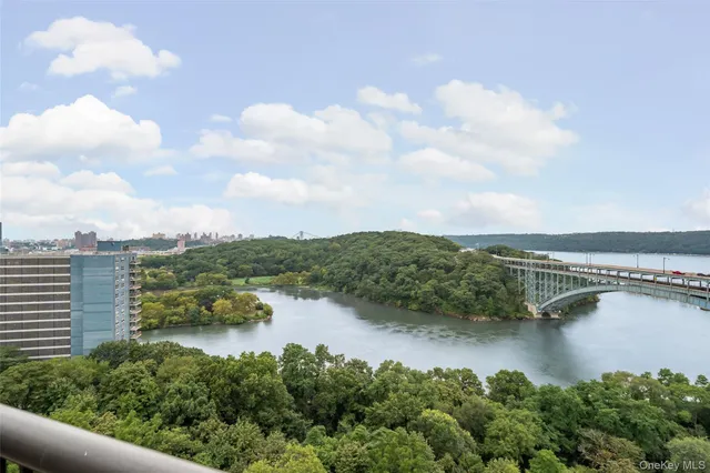 an aerial view of residential building and lake