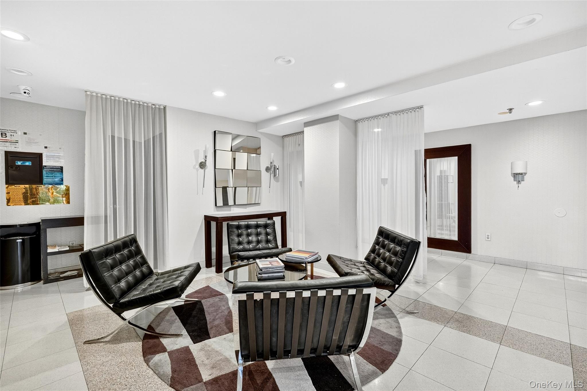 2287 Johnson Avenue, Unit 10B Bronx, NY 10463 - Photo 26 of 27 a living room with furniture and a flat screen tv