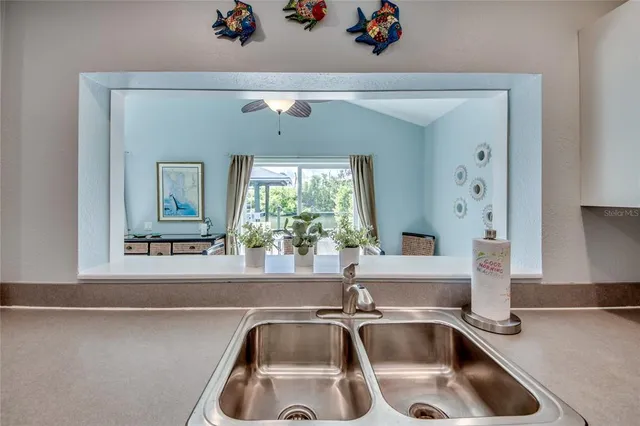 a spacious bedroom with a bed and a ceiling fan