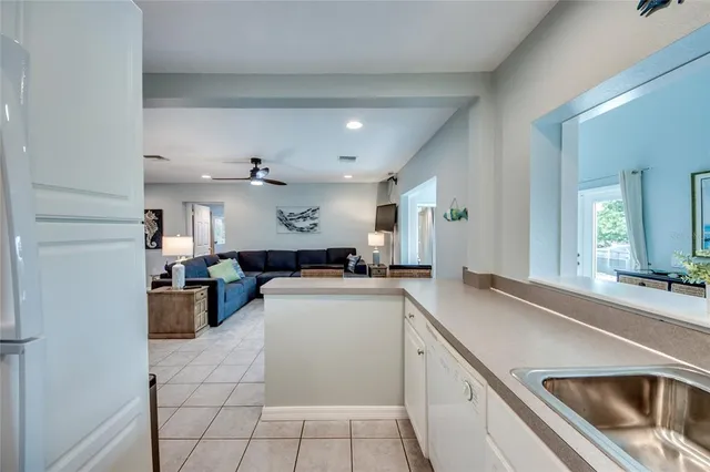 a bedroom with a bed and a mirror on dresser