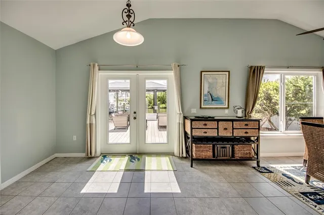 a bedroom with a large bed and a dresser