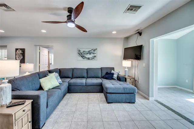 a kitchen with kitchen island a stove a table and chairs in it