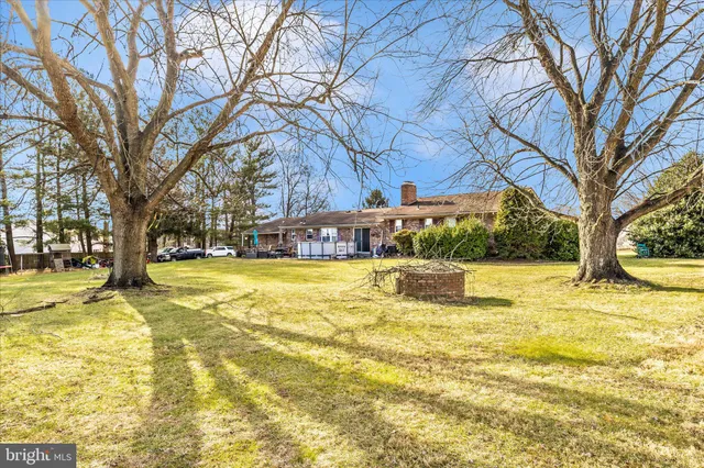 a view of a patio with table and chairs with wooden floor