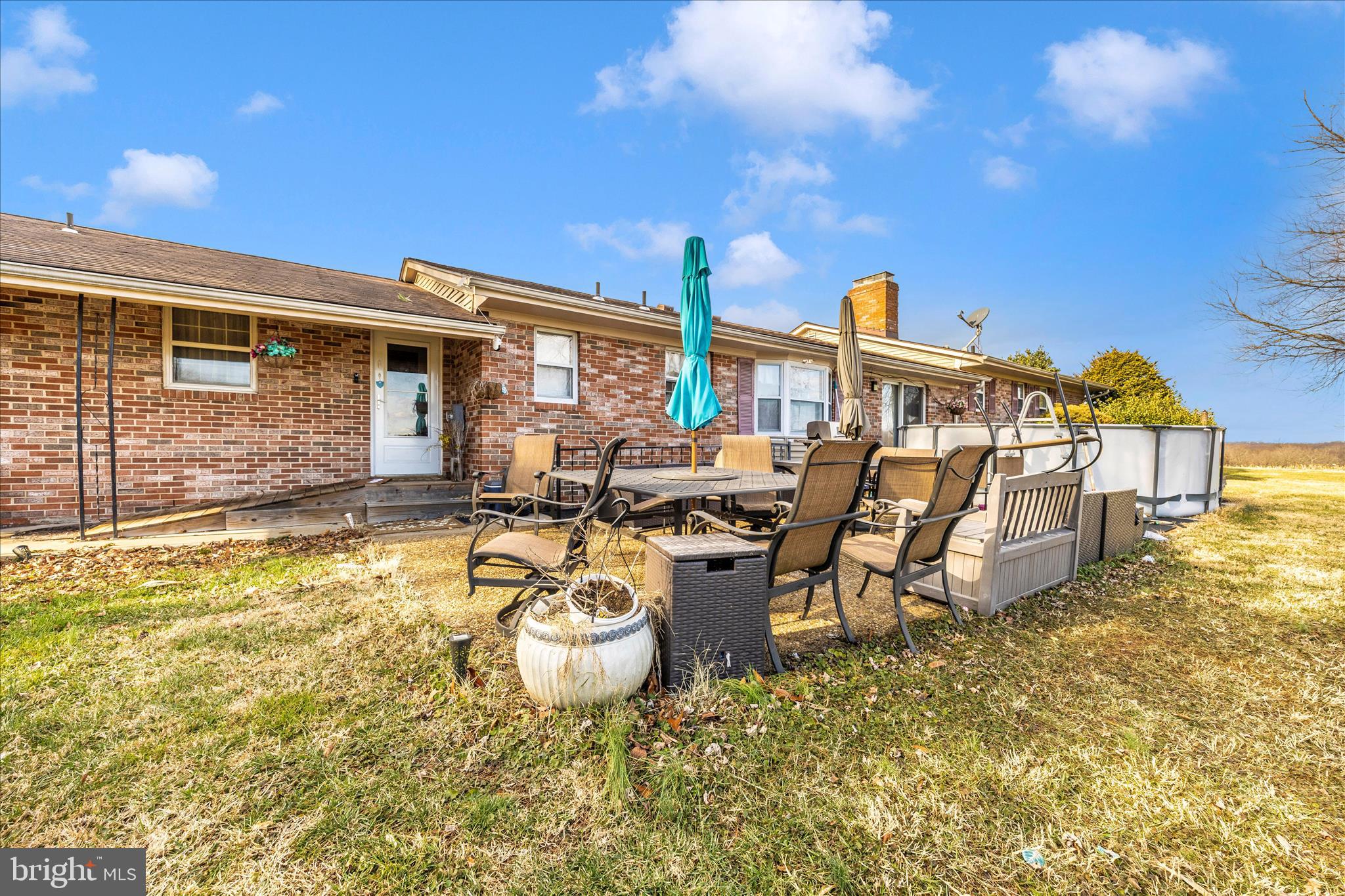 25801 Long Corner Road Gaithersburg, MD 20882 - Photo 12 of 52 a view of a patio with table and chairs with wooden floor