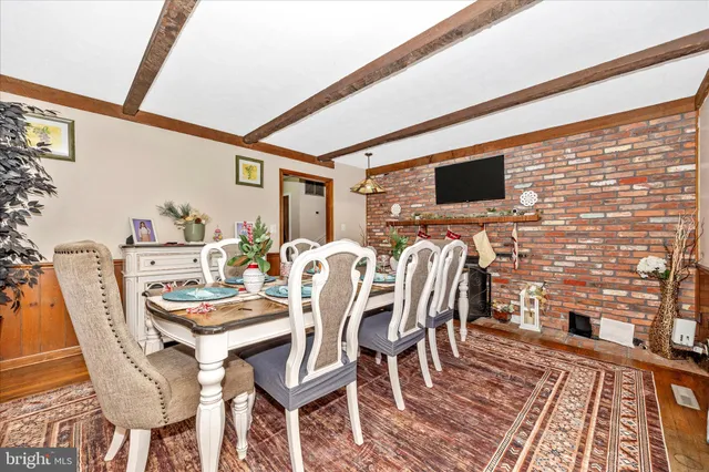 a outdoor living space with furniture and flat screen tv