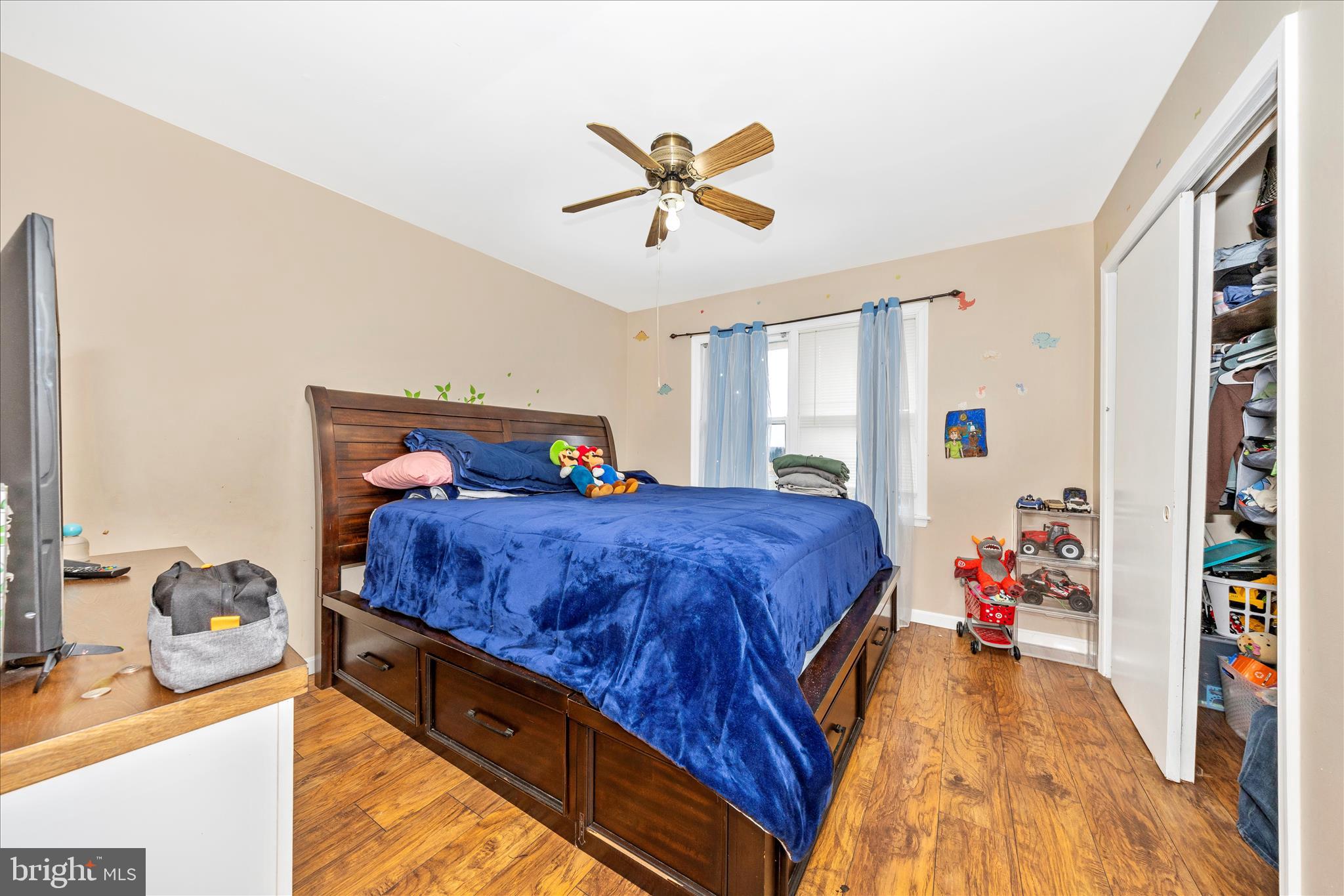 25801 Long Corner Road Gaithersburg, MD 20882 - Photo 30 of 52 a bed room with a bed and a chandelier