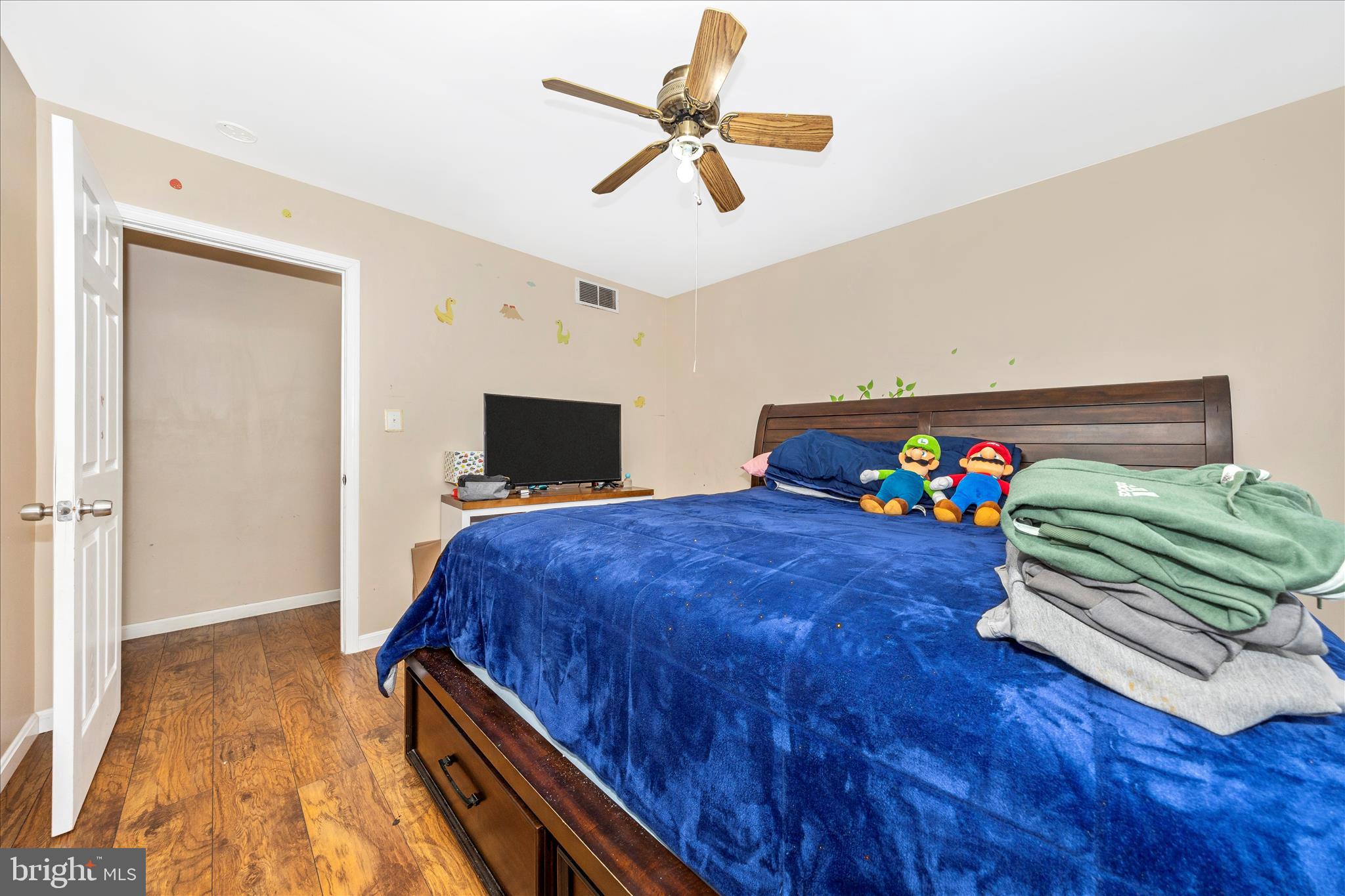 25801 Long Corner Road Gaithersburg, MD 20882 - Photo 31 of 52 a bedroom with a bed and a chandelier