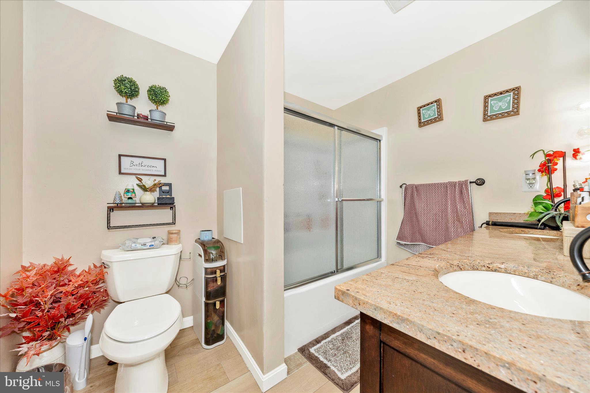 25801 Long Corner Road Gaithersburg, MD 20882 - Photo 37 of 52 a bathroom with a granite countertop toilet sink and mirror