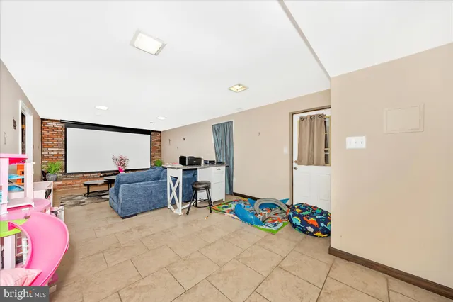 a living room with furniture and flowers