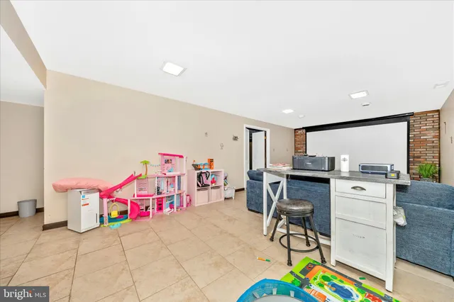 a bathroom with a toilet a sink and a mirror