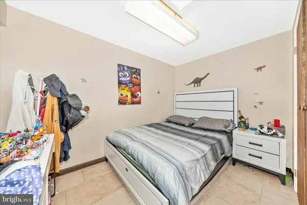 a bedroom with a bed and furniture