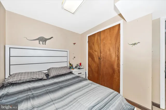 a bedroom with a bed and closet