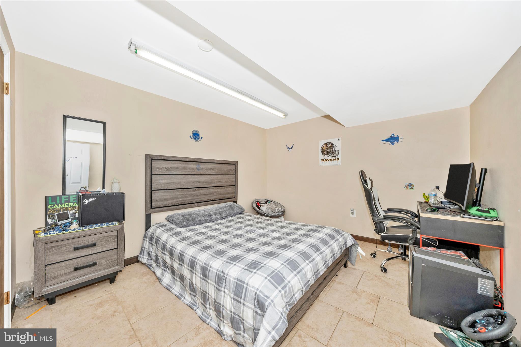 25801 Long Corner Road Gaithersburg, MD 20882 - Photo 48 of 52 a bedroom with a bed and furniture