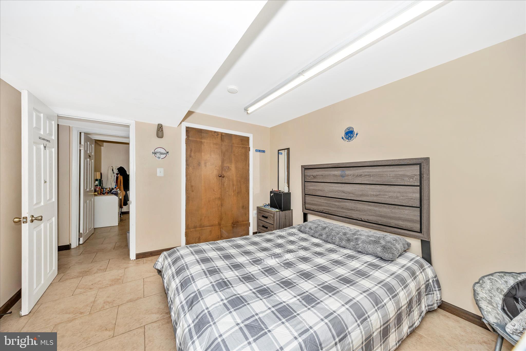 25801 Long Corner Road Gaithersburg, MD 20882 - Photo 49 of 52 a bedroom with a bed and closet