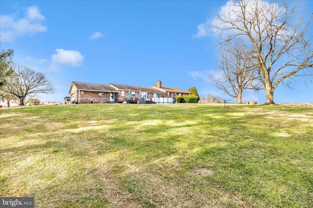 a view of a swimming pool with an outdoor space and seating area