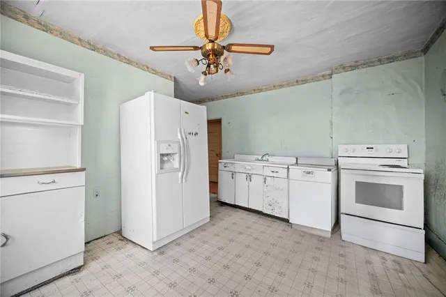 a view of a dining table and chairs in a room