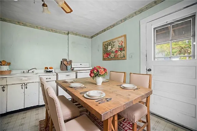 a view of a kitchen with a sink and cabinet area