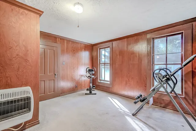 a view of a livingroom with furniture and windows