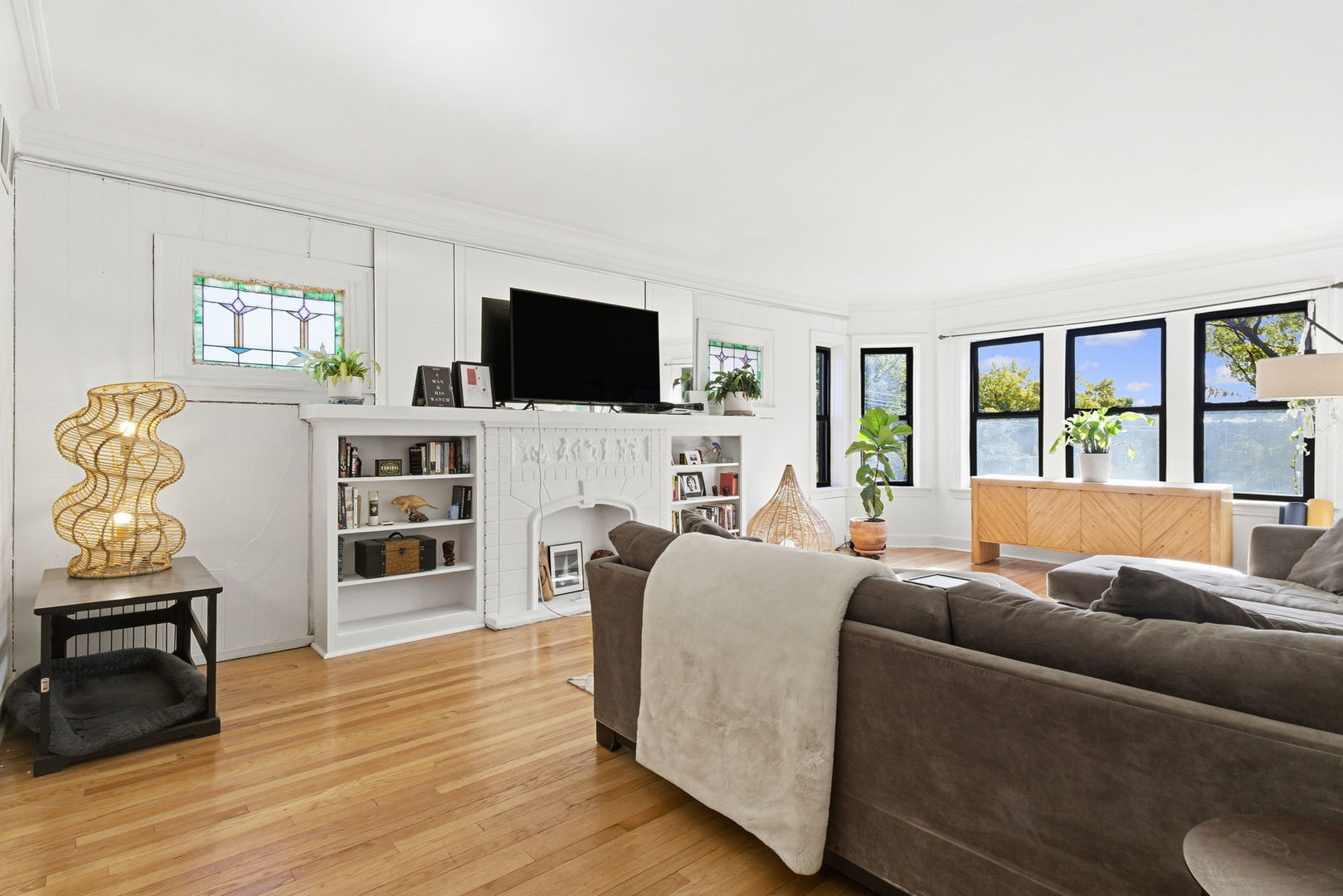 3414 West Medill Avenue, Unit 3 Chicago, IL 60647 - Photo 12 of 19 a living room with furniture and a flat screen tv