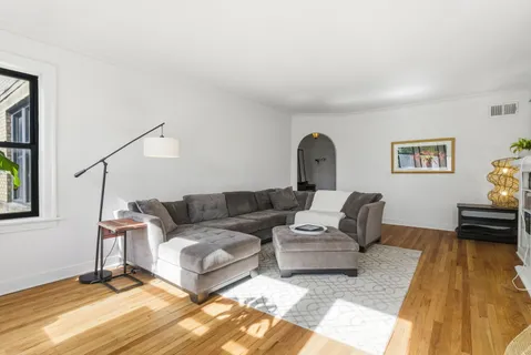 a living room with furniture and a rug