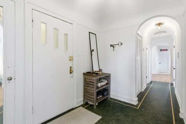 a view of a livingroom with furniture and staircase