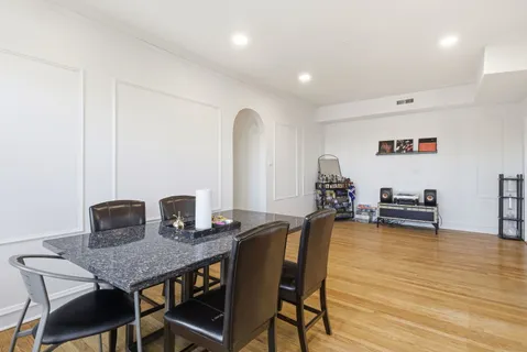 a view of a dining room with furniture and a wooden floor