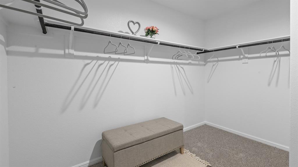 1617 Marsh Street Cleburne, TX 76033 - Photo 23 of 36 a view of a room with racks on the wall