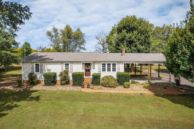front view of a house with a yard