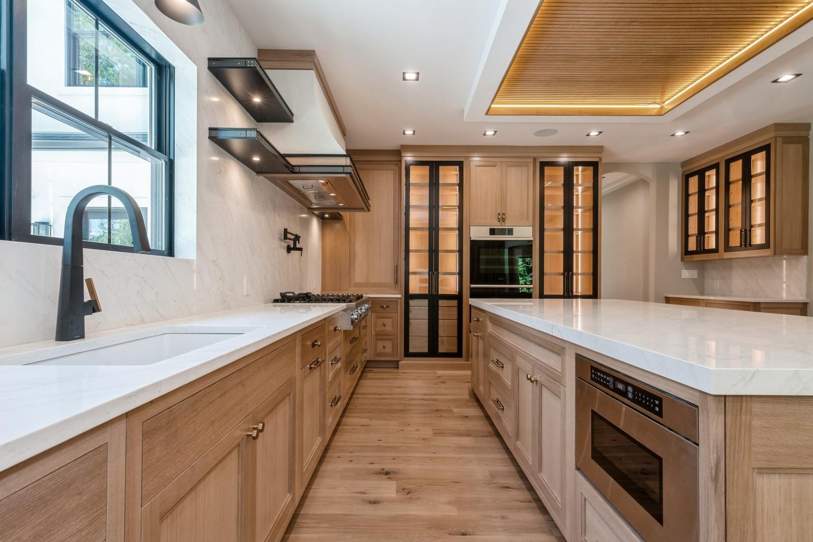 352 Cold Spring Road Syosset, NY 11791 - Photo 16 of 39 a large kitchen with a large window