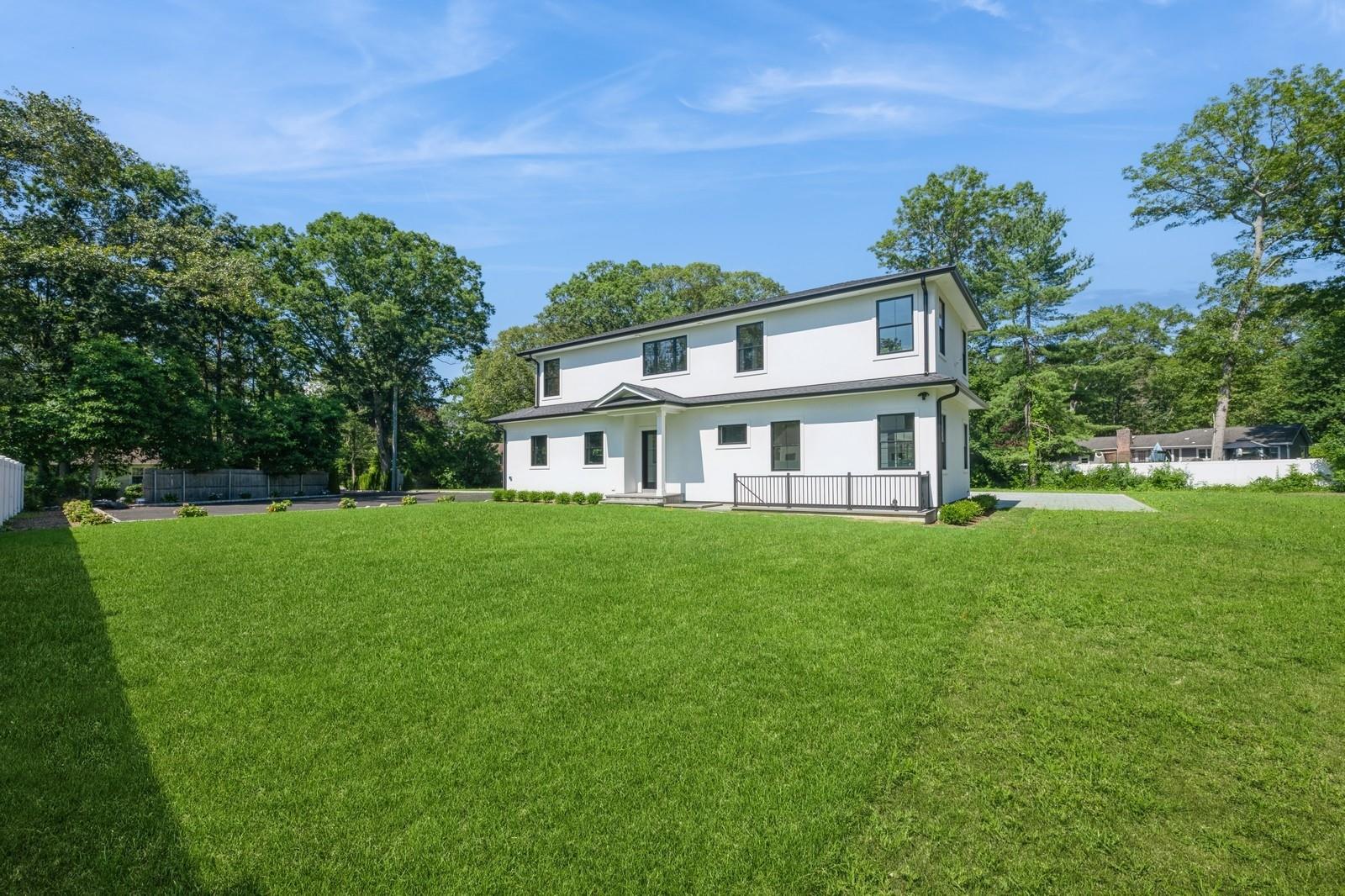 352 Cold Spring Road Syosset, NY 11791 - Photo 33 of 39 a front view of a house with a yard