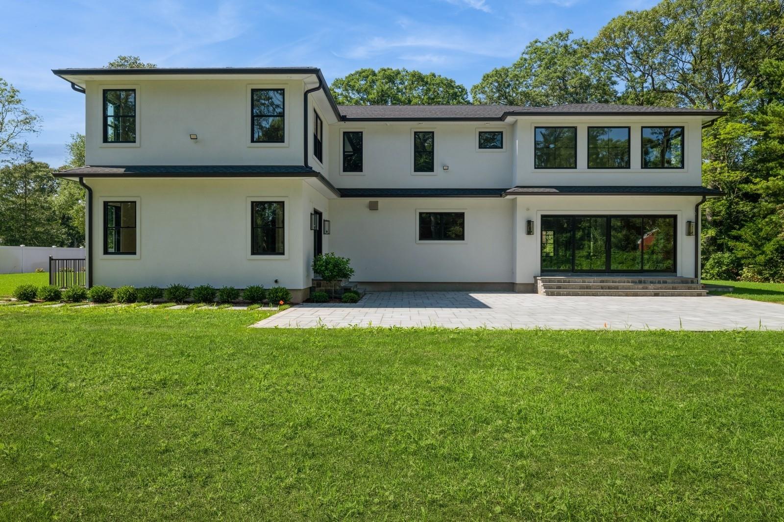 352 Cold Spring Road Syosset, NY 11791 - Photo 34 of 39 a front view of a house with a yard