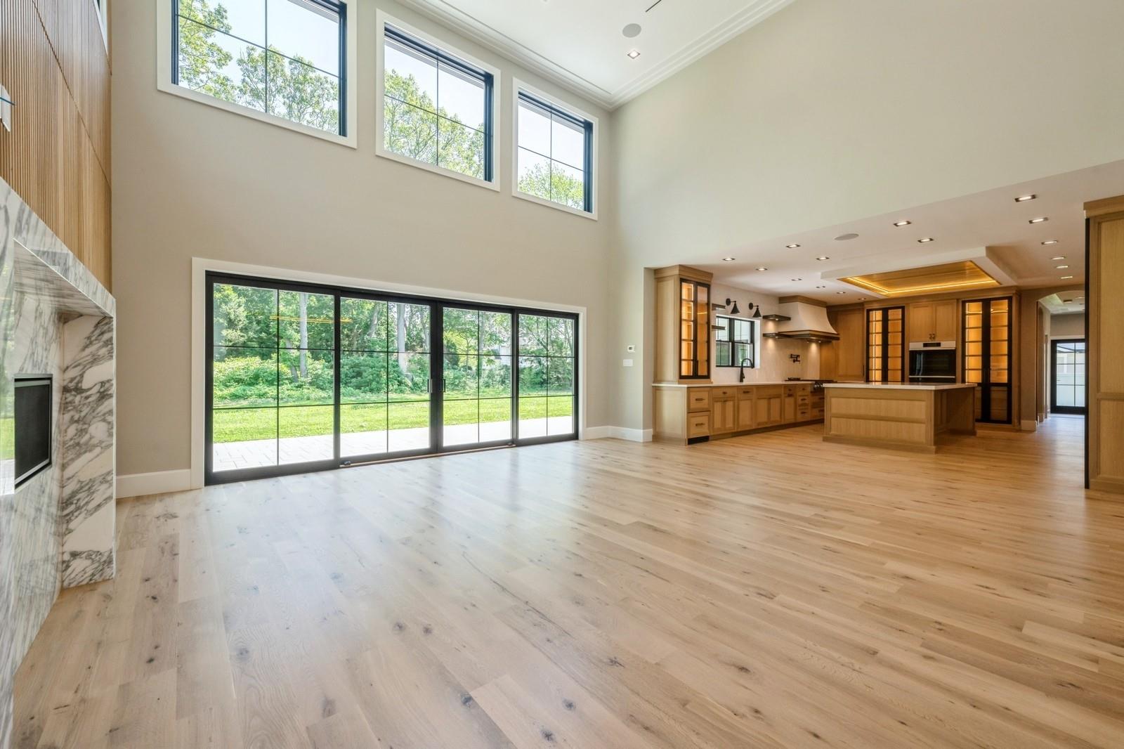 352 Cold Spring Road Syosset, NY 11791 - Photo 10 of 39 a view of a living room kitchen with furniture and wooden floor
