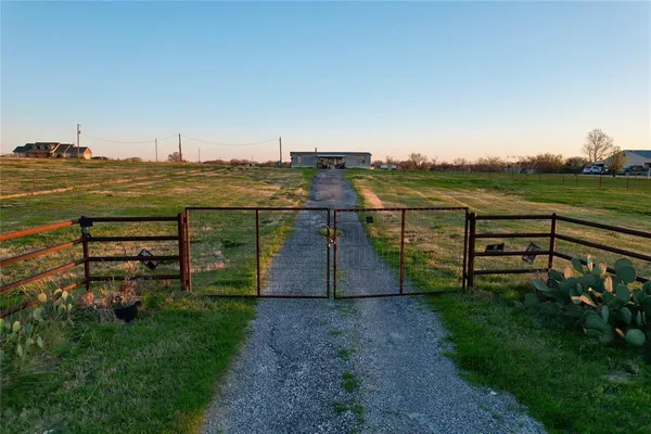 a view of a lake with a yard