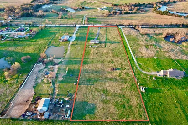 an aerial view of a houses with outdoor space