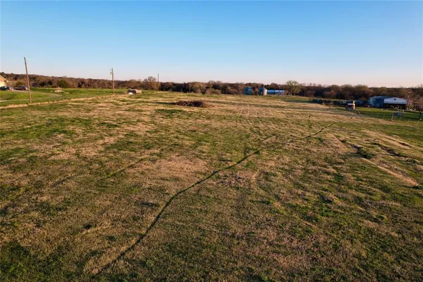 a view of a lake with a big yard