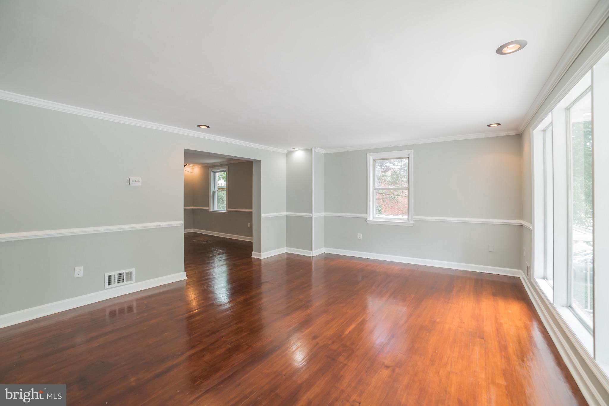 1310 Brixton Road Baltimore, MD 21239 - Photo 4 of 30 Large living room with real hardwood floors