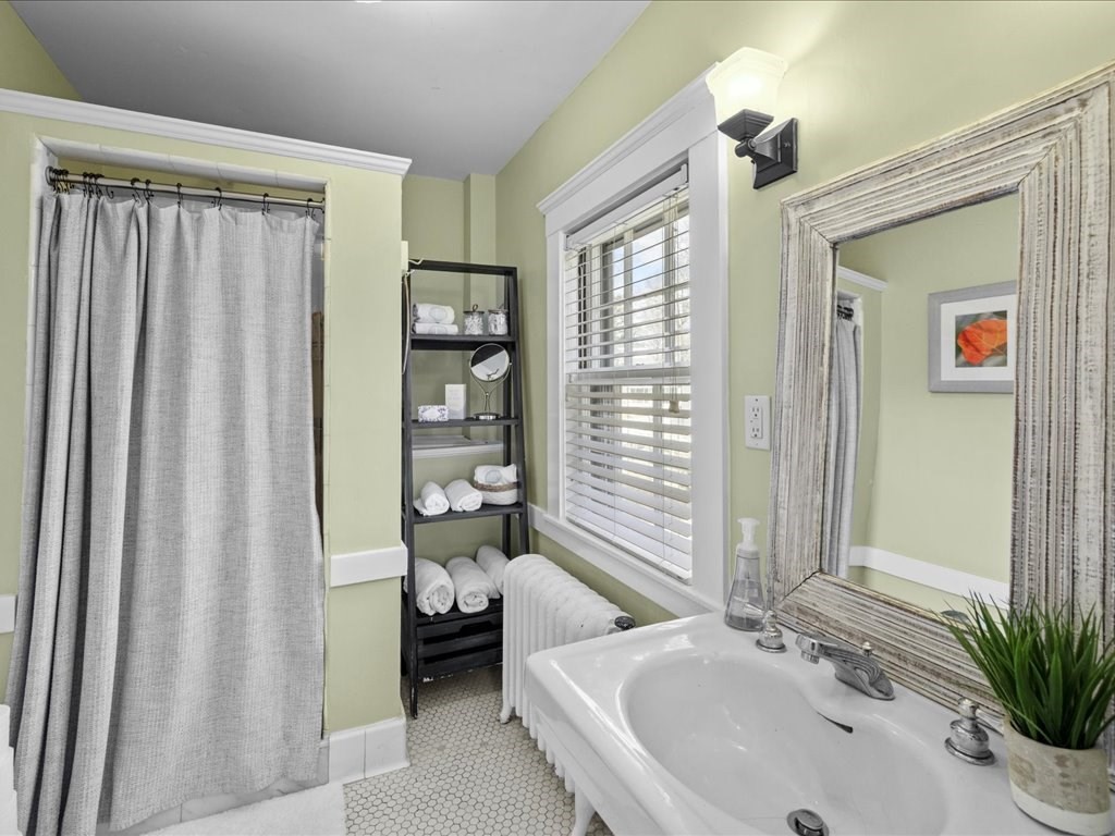 31 Estabrook Road Swampscott, MA 01907 - Photo 26 of 42 a en suite bathroom with a sink a mirror and a shower