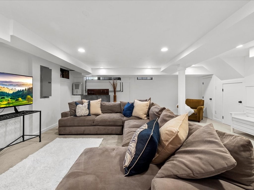 31 Estabrook Road Swampscott, MA 01907 - Photo 32 of 42 a living room with furniture and a flat screen tv