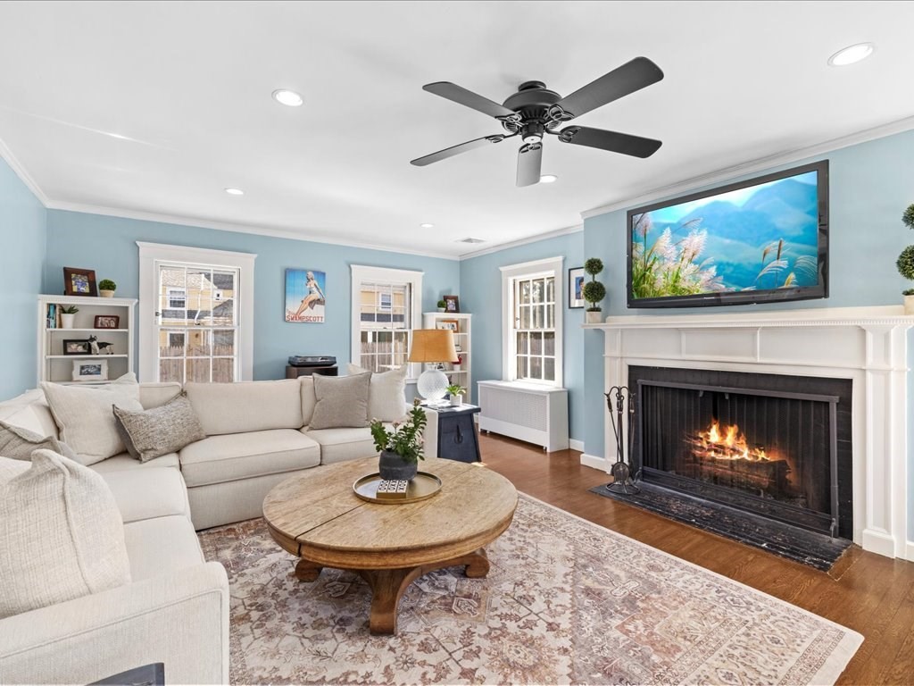 31 Estabrook Road Swampscott, MA 01907 - Photo 6 of 42 a living room with furniture a fireplace and a flat screen tv