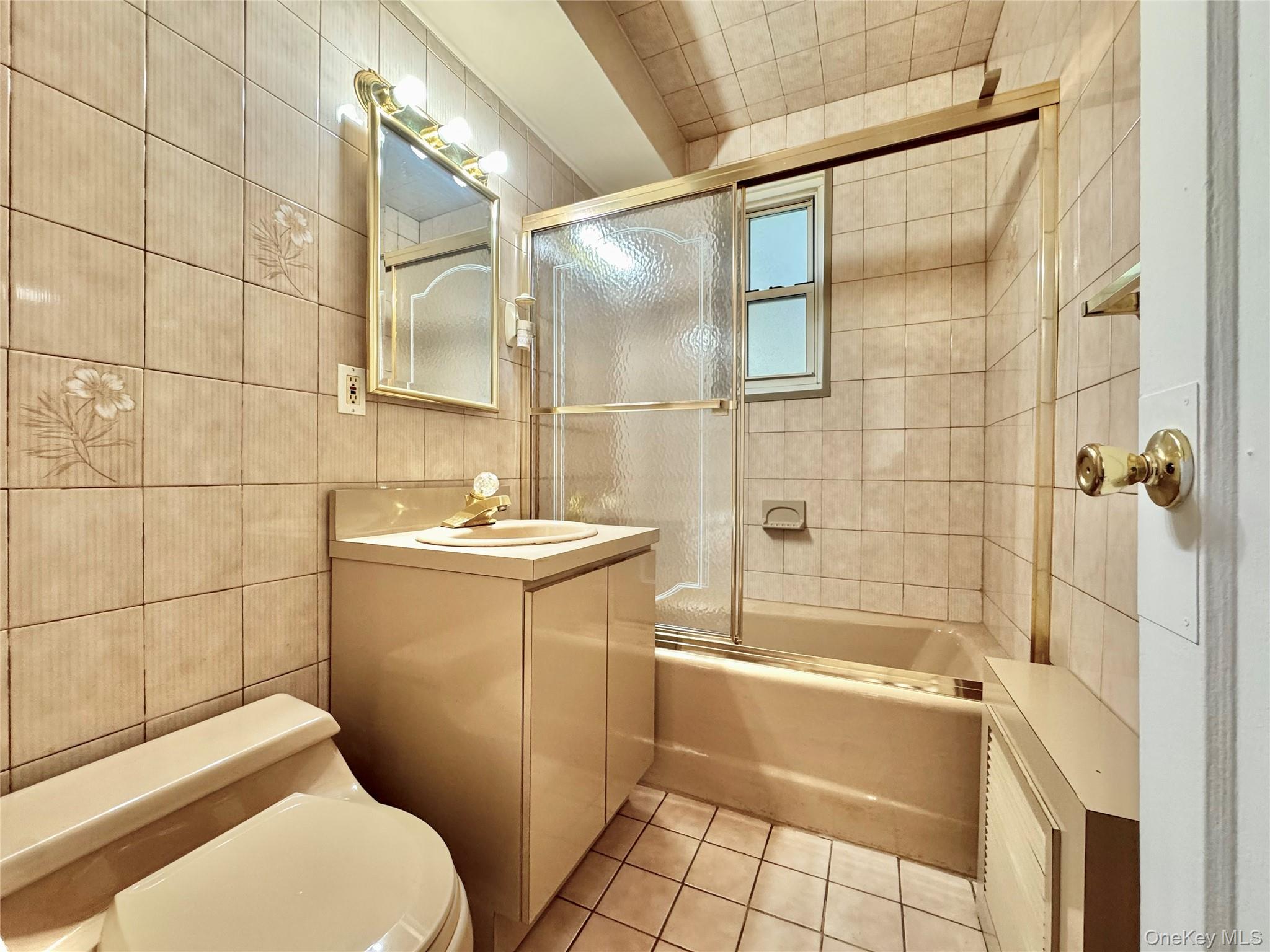35-40 Clearview Expressway, Unit 371 Queens, NY 11361 - Photo 9 of 10 a bathroom with a sink a toilet and shower