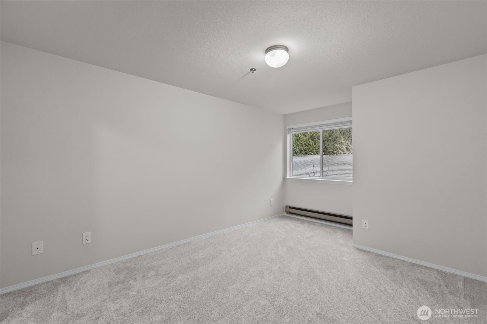 19404 Bothell Way Northeast, Unit B202 Bothell, WA 98011 - Photo 20 of 38 an empty room with windows