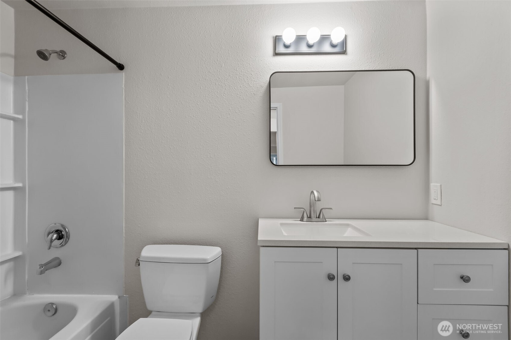 19404 Bothell Way Northeast, Unit B202 Bothell, WA 98011 - Photo 24 of 38 a bathroom with a toilet a sink and mirror