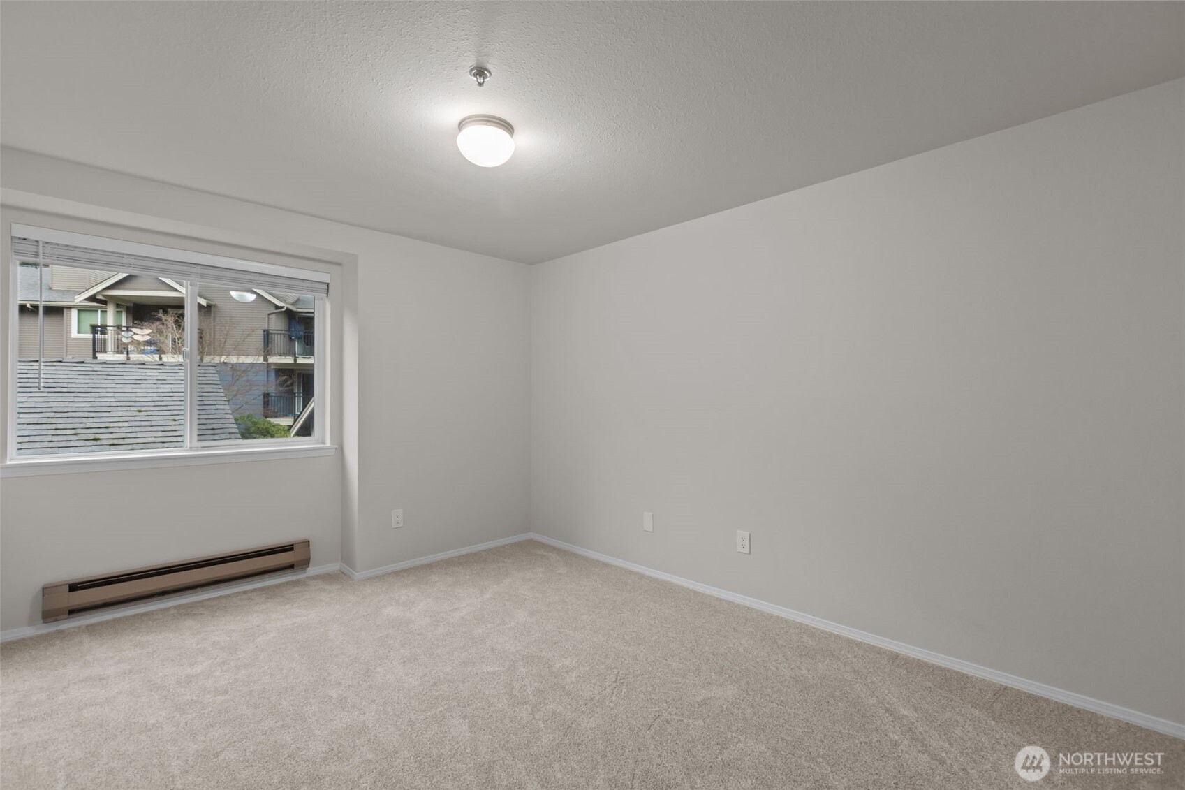 19404 Bothell Way Northeast, Unit B202 Bothell, WA 98011 - Photo 25 of 38 a view of an empty room with a window